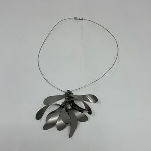 Silver necklace with matte finishes and polished finishes in its design